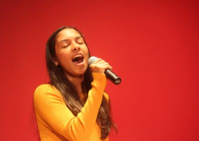 Young voice student performing